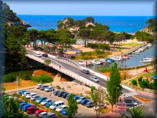 General view of the bridge of Cala Galdana, the beach and the nautical leisure area of the river of Cala Galdana
